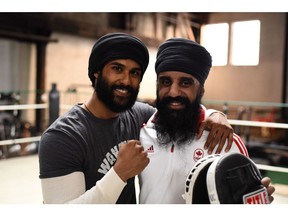 Prem Singh, left, and Pardeep Singh Nagra are seen on the set of the film "Tiger" in this undated handout photo. With a new film coming out about his fight inside and outside the ring as a Sikh boxer in Ontario, Pardeep Singh Nagra says the issues he faced almost two decades ago are still plaguing the sport.