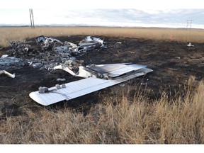 The Transportation Safety Board says a fatal small plane crash west of Calgary last year was likely due to a flight instructor and student losing control during an engine failure simulation done at too low an altitude. Wreckage of a small plane is seen in a field west of Calgary in an October 27, 2017, handout photo.