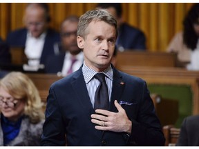Minister of Veterans Affairs Seamus O'Regan rises during question period in the House of Commons on Parliament Hill in Ottawa on Thursday, Sept. 27, 2018. The federal government says it shortchanged hundreds of thousands of veterans and their survivors over seven years, and is preparing to compensate them a total of $165 million.
