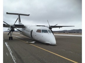 A plane is shown after it crash-landed at the airport in Stephenville, N.L., Thursday, Nov.15, 2018. Mayor Tom Rose says the nose gear collapsed on a PAL Airlines plane as it was landing just after noon local time today. THE CANADIAN PRESS/HO