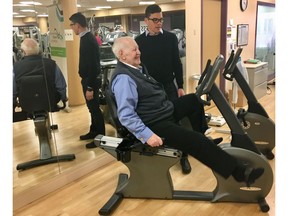 Former Nova Scotia premier John Buchanan (left) is shown with Jeff Zahavich, Certified Exercise Physiologist, ACCESS wellness program. Buchanan says the exercises have improved the range of movement in his arms and shoulders and his general mobility as he's been treated for prostate cancer that spread into other parts of his body.