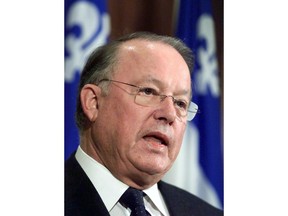 Quebec Premier Bernard Landry responds to questions before entering a government caucus meeting at the legislature in Quebec City on Tuesday Nov. 6, 2001. Landry has died at age 81.