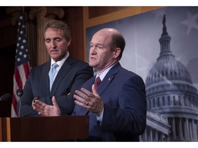 A group of U.S. senators is pushing President Donald Trump to fast-track the final text of the United States-Mexico-Canada Agreement in order to allow a vote in Congress before the end of the year. Sen. Jeff Flake, R-Ariz., left, and Sen. Chris Coons, D-Del., speak to reporters about their effort to bring up legislation to protect special counsel Robert Mueller, at the Capitol in Washington, Wednesday, Nov. 14, 2018.