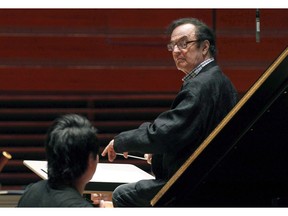 World-renowned conductor Charles Dutoit, right, performs with the Philadelphia Orchestra during a rehearsal in Philadelphia on October 19, 2011.