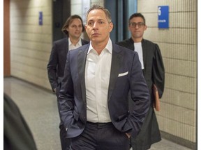 Yanai Elbaz, front, and his brother Yohann Elbaz, left, arrive for their fraud trial at the courthouse in relation to the MUHC hospital Monday, November 26, 2018 in Montreal.THE CANADIAN PRESS/Ryan Remiorz