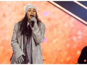 Alessia Cara performs during the half time show at the 106th Grey Cup between the Calgary Stampeders and the Ottawa Redblacks in Edmonton, Alta. Sunday, Nov. 25, 2018.