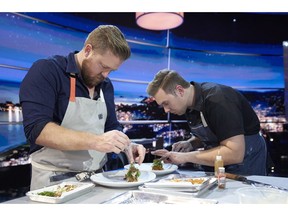 Chefs Timothy Hollingsworth, left, and Darren MacLean are shown in a scene from Netflix's "The Final Table" in this undated handout photo. Calgary chef Darren MacLean says it's time the world recognizes his city as the next foodie hotspot. And so the outspoken culinary whiz shines a light on his Alberta city this week as the sole Canadian contender on Netflix's new competitive cooking series "The Final Table."