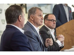 A businessman trying to bring a CFL team to Halifax says a contest to come up with a team name is a "horse race" between Atlantic Schooners and Atlantic Storm. CFL commissioner, Randy Ambrosie, centre, speaks to reporters during a press conference with Maritime Football Limited Partnership founding partners Bruce Bowser, left, and Anthony LeBlanc in Halifax on Wednesday, November 7, 2018.