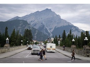Pedestrians cross the street in Banff National Park.