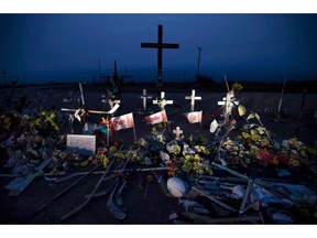 A committee working on how to distribute $15.2 million raised in a GoFundMe campaign after the Humboldt Broncos bus crash says a court should respect the families' wishes on how the money should be divided. A memorial made of hockey sticks, crosses and Canadian flags is seen at the crash site of the Humboldt Broncos hockey team near Tisdale, Sask., Friday, August, 24, 2018.