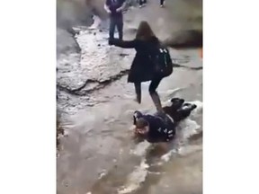 Advocates say a disturbing video showing a Cape Breton teen's classmates walking over him in a stream demonstrates how the lives of people with disabilities are often devalued. A screengrab from the video posted to Facebook is shown in a handout. THE CANADIAN PRESS/HO-Facebook MANDATORY CREDIT