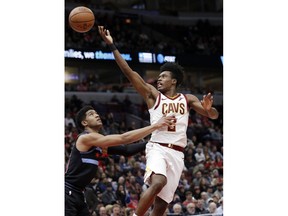 Cleveland Cavaliers guard Collin Sexton, right, shoots against Chicago Bulls forward Chandler Hutchison during the first half of an NBA basketball game Saturday, Nov. 10, 2018, in Chicago.