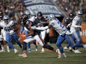 Chicago Bears wide receiver Allen Robinson (12) runs against Detroit Lions defensive back DeShawn Shead (26) during the first half of an NFL football game Sunday, Nov. 11, 2018, in Chicago.