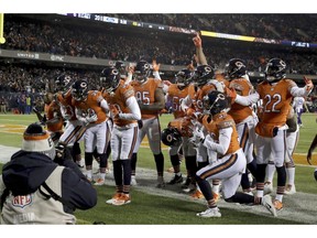 Chicago Bears free safety Eddie Jackson (39) celebrates with his teammates after intercepting and running for a touchdown during the second half of an NFL football game against the Minnesota Vikings Sunday, Nov. 18, 2018, in Chicago.