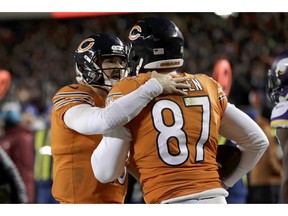 Chicago Bears quarterback Mitchell Trubisky (10) celebrates with tight end Adam Shaheen (87) after successfully throwing a 2-point conversion pass during the second half of an NFL football game against the Minnesota Vikings Sunday, Nov. 18, 2018, in Chicago.