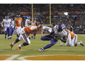 Minnesota Vikings wide receiver Aldrick Robinson (17) makes a touchdown reception against Chicago Bears linebacker Danny Trevathan (59) during the second half of an NFL football game Sunday, Nov. 18, 2018, in Chicago.