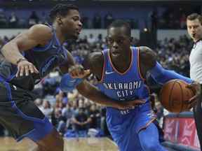 Dallas Mavericks guard Dennis Smith Jr. (1) defends against the drive by Oklahoma City Thunder guard Dennis Schroder (17) in the first half of an NBA basketball game Saturday, Nov. 10, 2018, in Dallas.