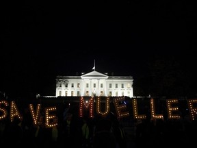 Protesters gather in front of the White House in Washington, Thursday, Nov. 8, 2018, as part of a nationwide "Protect Mueller" campaign demanding that Acting U.S. Attorney General Matthew Whitaker recuse himself from overseeing the ongoing special counsel investigation.