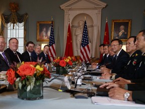 Secretary of Defense Jim Mattis, left, Secretary of State Mike Pompeo, second from left, Chinese Politburo Member Yang Jiechi, third from right, and Chinese State Councilor and Defense Minister General Wei Fenghe, second from right, meet at the State Department in Washington, Friday, Nov. 9, 2018.