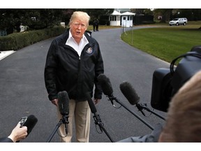 President Donald Trump answers questions from members of the media as he leaves the White House, Saturday Nov. 17, 2018, in Washington, en route to see fire damage in California.