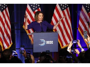House Minority Leader Nancy Pelosi of Calif., smiles as she is cheered by a crowd of Democratic supporters during an election night returns event at the Hyatt Regency Hotel, on Tuesday, Nov. 6, 2018, in Washington.