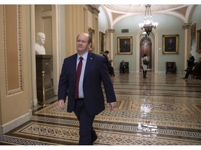 Sen. Chris Coons, D-Del., arrives at the Capitol in Washington, Wednesday, Nov. 14, 2018, as he and Sen. Jeff Flake, R-Ariz., prepare to call for a floor vote on legislation to protect Special Counsel Robert Mueller in the wake of former Attorney General Jeff Sessions's forced resignation by President Donald Trump and replacing him with Matthew Whitaker, a Trump loyalist.