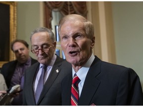 Sen. Bill Nelson, D-Fla., whose re-election contest against Republican Gov. Rick Scott is still undecided, is joined by Senate Minority Leader Chuck Schumer, D-N.Y., left, at a news conference at the Capitol in Washington, Tuesday, Nov. 13, 201816.