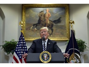 President Donald Trump talks about immigration and gives an update on border security from the Roosevelt Room of the White House in Washington, Thursday, Nov. 1, 2018. Trump says asylum seekers must go to ports of entry in order to make a claim. He says he will issue an executive order next week on immigration.