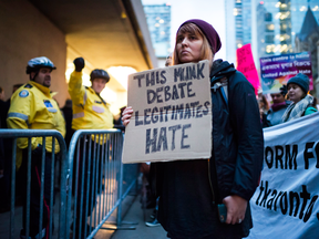 Protesters outside a Toronto Munk debate featuring Steve Bannon and conservative commentator David Frum in Toronto on Friday, Nov. 2, 2018.