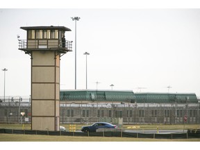 FILE - In this Feb. 1, 2017, file photo, a prison guard stands on a tower during a hostage situation at James T. Vaughn Correctional Center in Smyrna, Del. One of three inmates on trial for a deadly Delaware prison riot was found guilty of murder Tuesday, Nov. 20, 2018, the first verdicts in a case that will involve 17 inmates over the next several months.