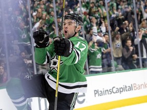 Dallas Stars center Devin Shore celebrates after scoring a goal against the San Jose Sharks during the first period of an NHL hockey game Thursday, Nov. 8, 2018, in Dallas.