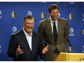 Dallas Mayor Mike Rawlings, left, and Dallas Mavericks player Dirk Nowitzki talk to the media about Nowitzki receiving the key to the city during a news conference prior to an NBA basketball game in Dallas, Wednesday, Nov. 21, 2018.