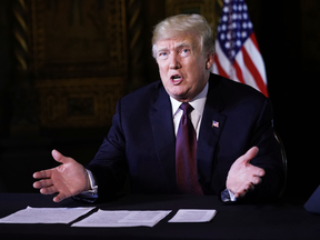 U.S. President Donald Trump speaks to reporters at his Mar-a-Lago resort in Palm Beach, Florida, on Thanksgiving Day, Nov. 22, 2018.