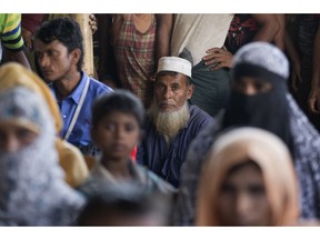 Rohingya refugees wait for news on the repatriation process at Unchiprang refugee camp near Cox's Bazar, in Bangladesh, Thursday, Nov. 15, 2018. The head of Bangladesh's refugee commission said plans to begin a voluntary repatriation of Rohingya Muslim refugees to their native Myanmar on Thursday were scrapped after officials were unable to find anyone who wanted to return.