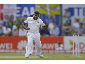 Sri Lanka's Rangana Herath celebrates taking the wicket of England's Joe Root during the third day of the first test cricket match between Sri Lanka and England in Galle, Sri Lanka, Thursday, Nov. 8, 2018.