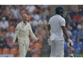England's Jack Leach celebrates after taking the wicket of Sri Lanka's Dilruwan Perera, right, during the fourth day of the second test cricket match between Sri Lanka and England in Pallekele, Sri Lanka, Saturday, Nov. 17, 2018.