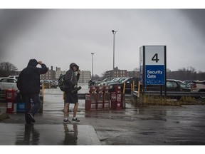 Workers from Oshawa's General Motors car assembly leave the plant, Monday Nov 26 , 2018. General Motors will close its production plant in Oshawa, Ont., along with four facilities in the U.S. as part of a global reorganization that will see the company focus on electric and autonomous vehicle programs.