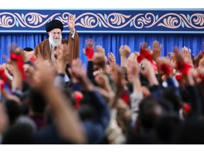 In this picture released by an official website of the office of the Iranian supreme leader, Supreme Leader Ayatollah Ali Khamenei waves to the crowd during a meeting in Tehran, Iran, Saturday, Nov. 3, 2018. Khamenei says on the eve of the anniversary of the 1979 takeover of the U.S. Embassy in Tehran that the Islamic Republic is the "victorious party" after nearly 40 years of confrontation by the U.S. (Office of the Iranian Supreme Leader via AP)