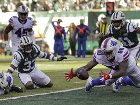 Buffalo Bills tight end Jason Croom (80) recovers a fumble by wide receiver Zay Jones , left, for a touchdown against the New York Jets during the first quarter of an NFL football game, Sunday, Nov. 11, 2018, in East Rutherford, N.J.