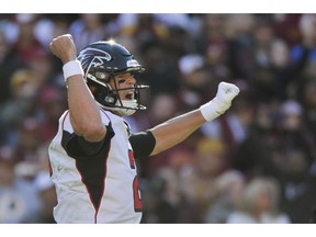 Atlanta Falcons quarterback Matt Ryan (2) celebrates running back Ito Smith's touchdown during the first half of an NFL football game against the Washington Redskins, Sunday, Nov. 4, 2018, in Landover, Md.