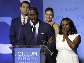 Florida Democratic gubernatorial candidate Andrew Gillum gives his concession speech as he is joined on stage by his wife R. Jai Gillum, right, and running mate Chris King and his wife Kristen Tuesday, Nov. 6, 2018, in Tallahassee, Fla. Gillum lost the Florida governor's race to Republican Ron DeSantis.