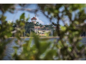 President Donald Trump's Mar-a-Lago estate is framed in the Mangrove trees in Palm Beach, Fla., Friday, Nov. 23, 2018, as Trump continues his holiday vacation.