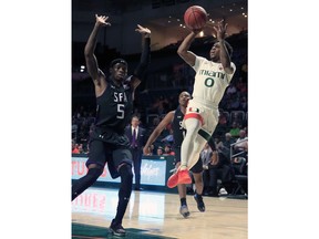 Miami guard Chris Lykes (0) takes a shot at the basket during the first half of an NCAA college basketball game against Stephen F. Austin, Tuesday, Nov. 13, 2018 in Coral Gables, Fla.