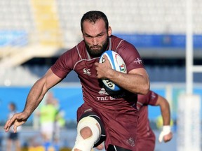 Georgia's Tamaz Mchedlidze runs with the ball is on his way to score a try during an international test match between Italy and Georgia, at the Artemio Franchi stadium in Florence, Italy, Saturday, Nov. 10, 2018.