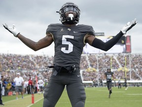 Central Florida wide receiver Dredrick Snelson (5) celebrates in the end zone after scoring a 34-yard receiving touchdown during the first half of an NCAA college football game against Navy, Saturday, Nov. 10, 2018, in Orlando, Fla.