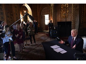 President Donald Trump speaks to reporters following his teleconference with troops from his Mar-a-Lago estate in Palm Beach, Fla., Thursday, Nov. 22, 2018.