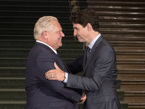 Ontario Premier Doug Ford greets Canadian Prime Minister Justin Trudeau in Toronto on July 5, 2018.