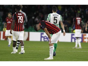 FILE - In this Thursday, Nov. 8, 2018 file photo, AC Milan's Patrick Cutrone reacts at the end of the Europa League, Group F soccer match between AC Milan and Betis, at the Benito Villamarin Stadium in Seville, Spain. AC Milan is preparing for another hearing before UEFA's club finance panel next week. In July, the Court of Arbitration for Sport in July overturned a ban imposed on the seven-time European champion for overspending. CAS said the one-year exclusion from European competition was too harsh considering Milan's recent takeover by U.S.-based hedge fund Elliott Management.