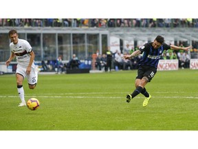 Inter Milan's Matteo Politano, right, scores his side's second goal during the Serie A soccer match between Inter Milan and Genoa at the San Siro Stadium in Milan, Italy, Saturday, Nov. 3, 2018.