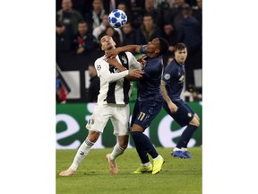 Juventus defender Mattia De Sciglio and ManU forward Anthony Martial, right, vie for the ball during the Champions League group H soccer match between Juventus and Manchester United at the Allianz stadium in Turin, Italy, Wednesday, Nov. 7, 2018.